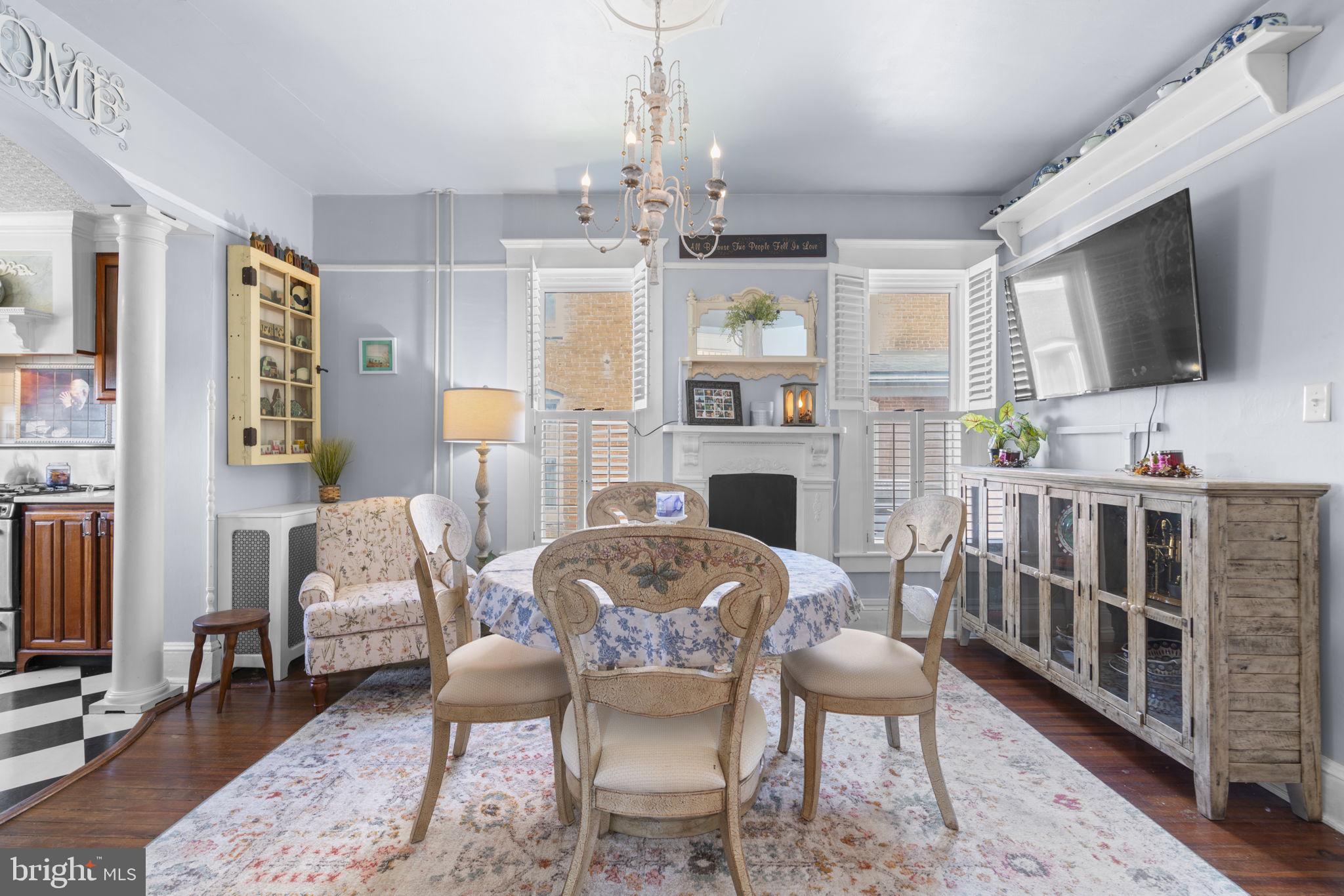 1916 Hanover Pike Hampstead, MD 21074 - Photo 14 of 46 a living room with furniture a fireplace and a flat screen tv
