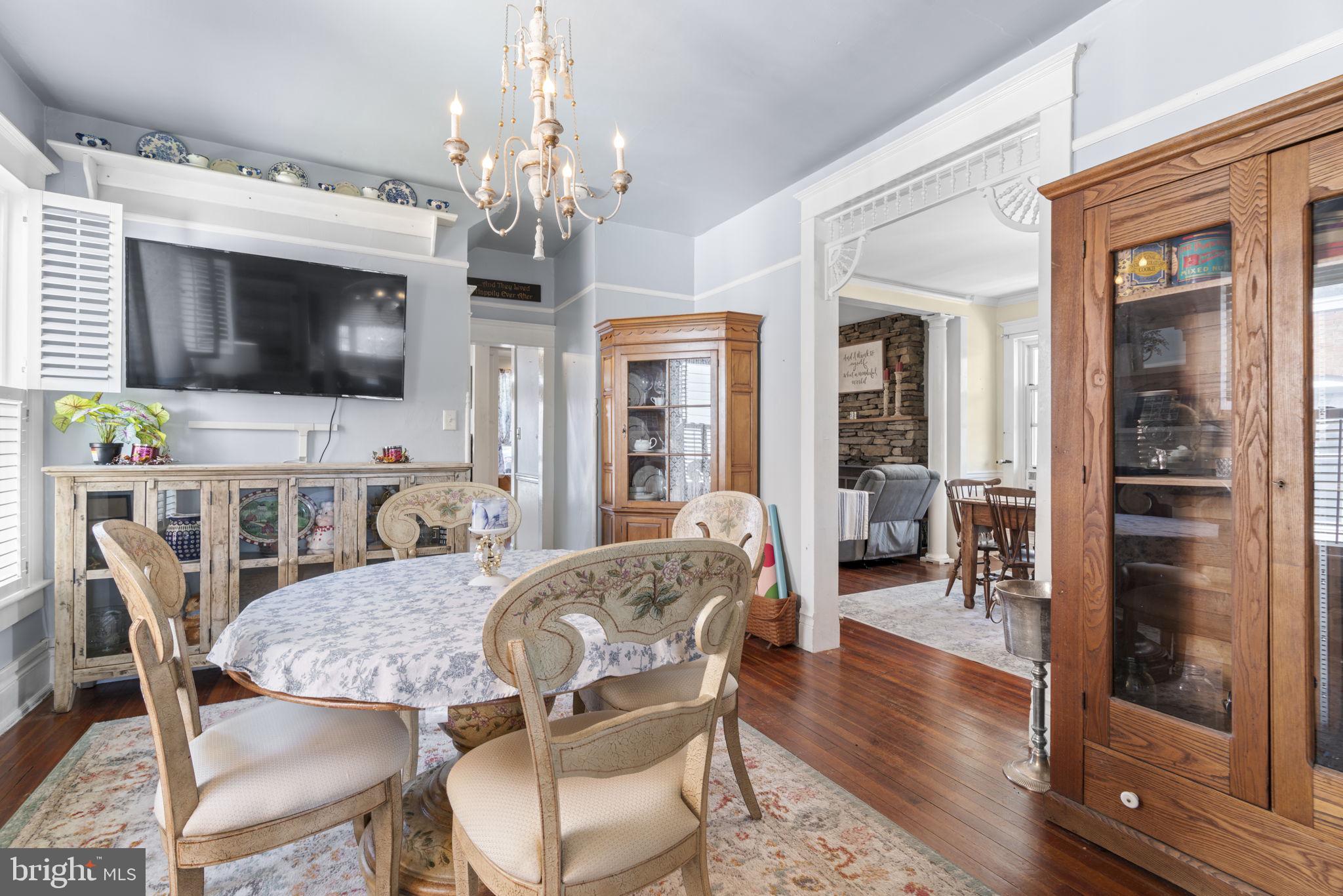 1916 Hanover Pike Hampstead, MD 21074 - Photo 15 of 46 a view of a dining room with furniture wooden floor and chandelier
