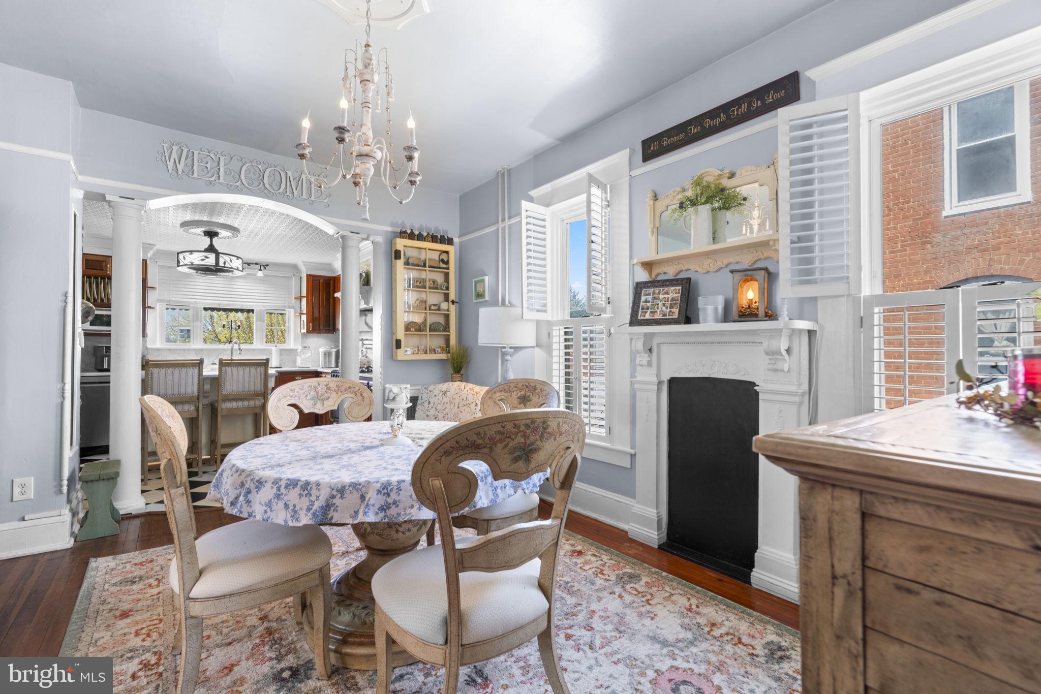 1916 Hanover Pike Hampstead, MD 21074 - Photo 16 of 46 a living room with furniture a fireplace and a chandelier