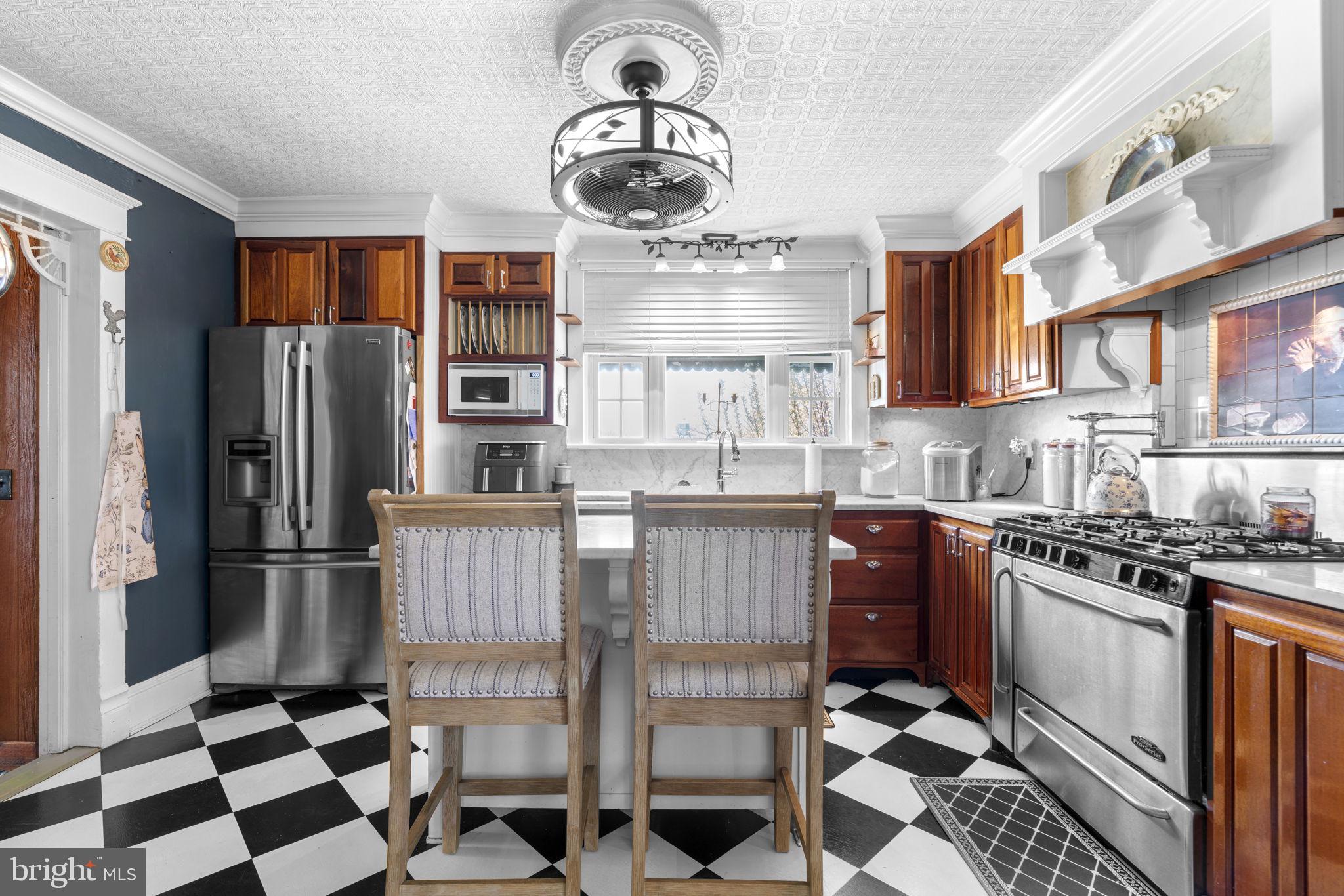 1916 Hanover Pike Hampstead, MD 21074 - Photo 17 of 46 a kitchen with stainless steel appliances granite countertop a refrigerator a stove a sink and a microwave