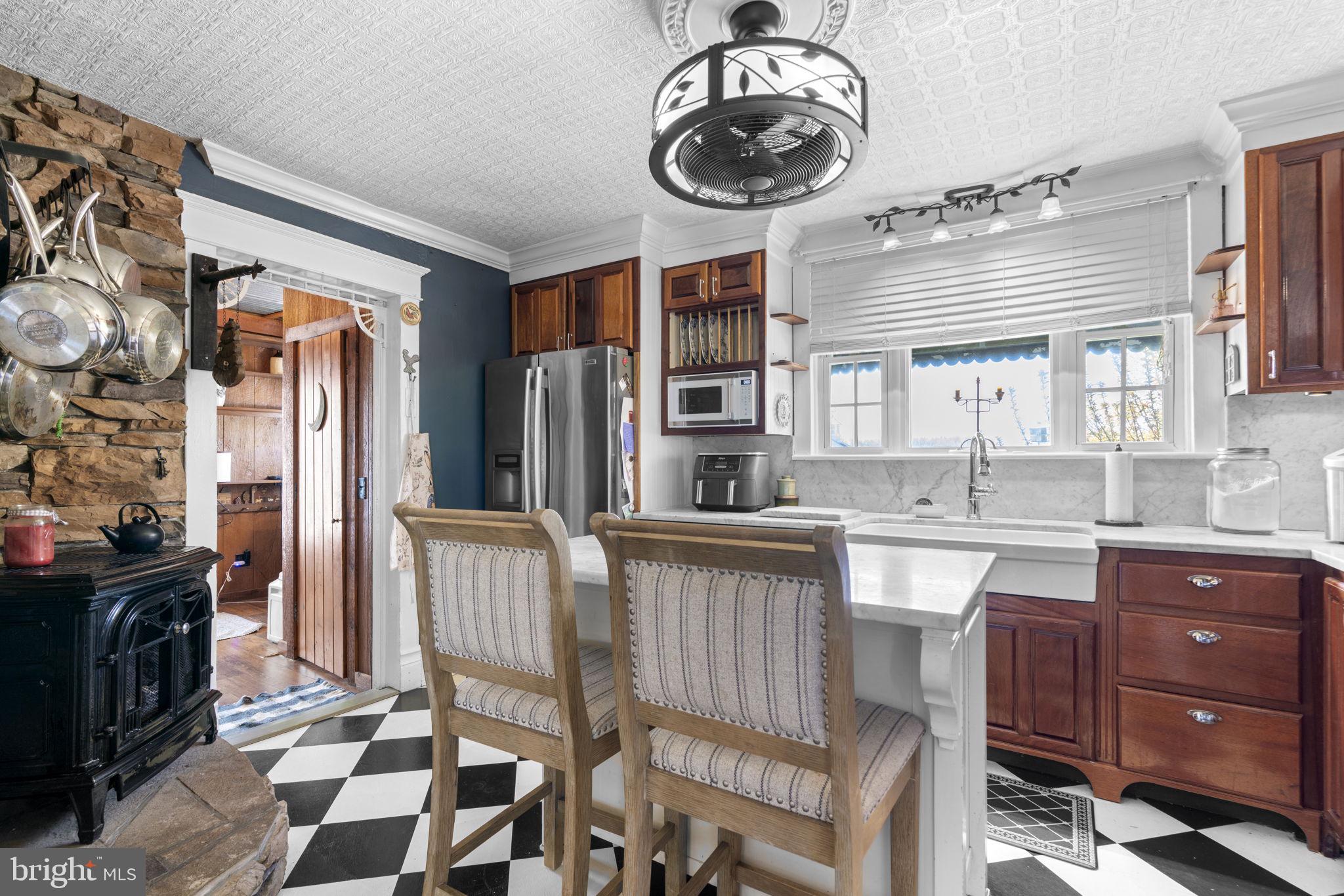 1916 Hanover Pike Hampstead, MD 21074 - Photo 18 of 46 a kitchen with stainless steel appliances granite countertop a sink and cabinets