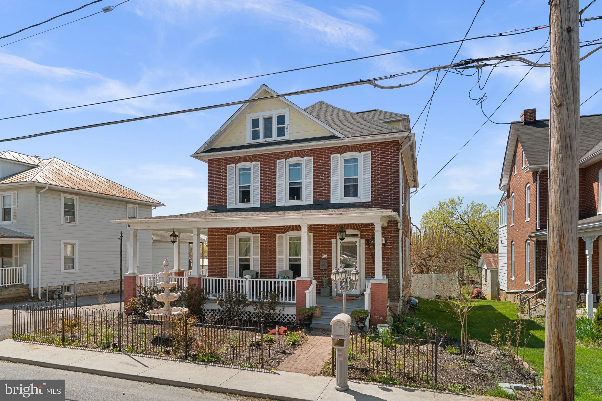 1916 Hanover Pike Hampstead, MD 21074 - Photo 2 of 46 a front view of a house with garden