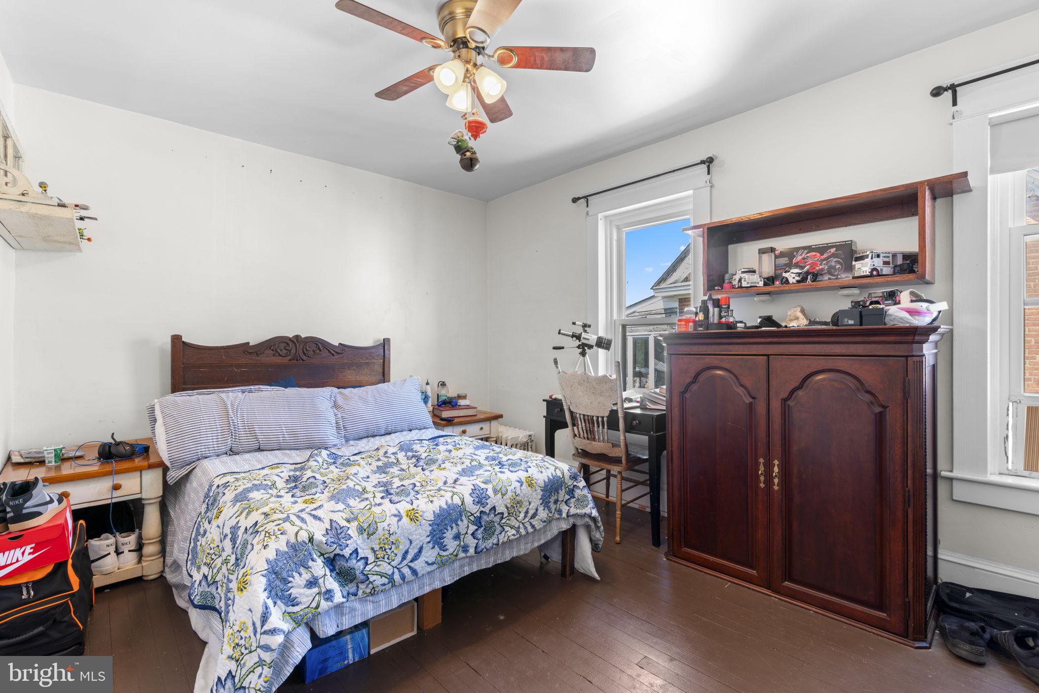 1916 Hanover Pike Hampstead, MD 21074 - Photo 31 of 46 a bedroom with a bed and a chandelier