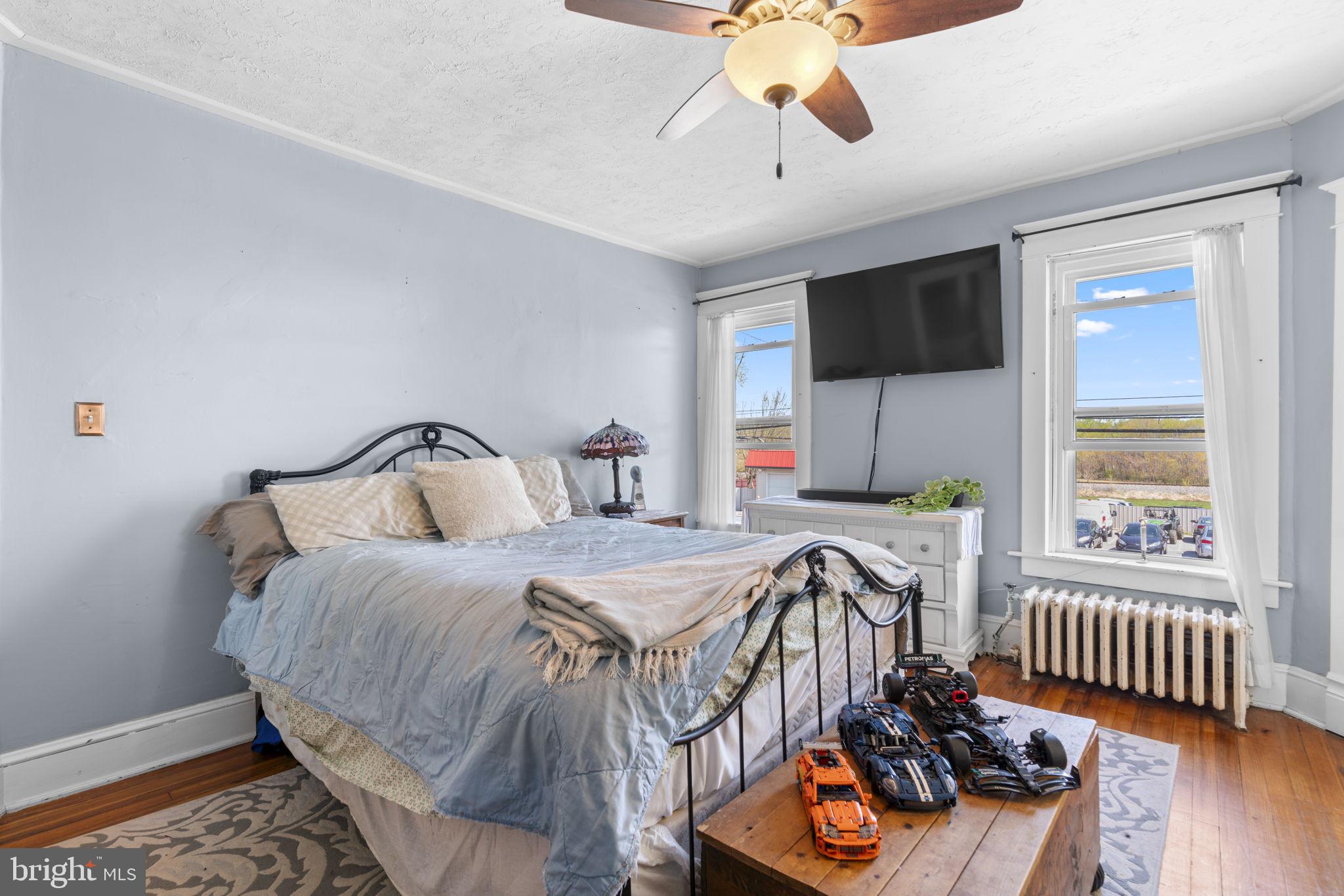 1916 Hanover Pike Hampstead, MD 21074 - Photo 33 of 46 a bedroom with bed and a chandelier