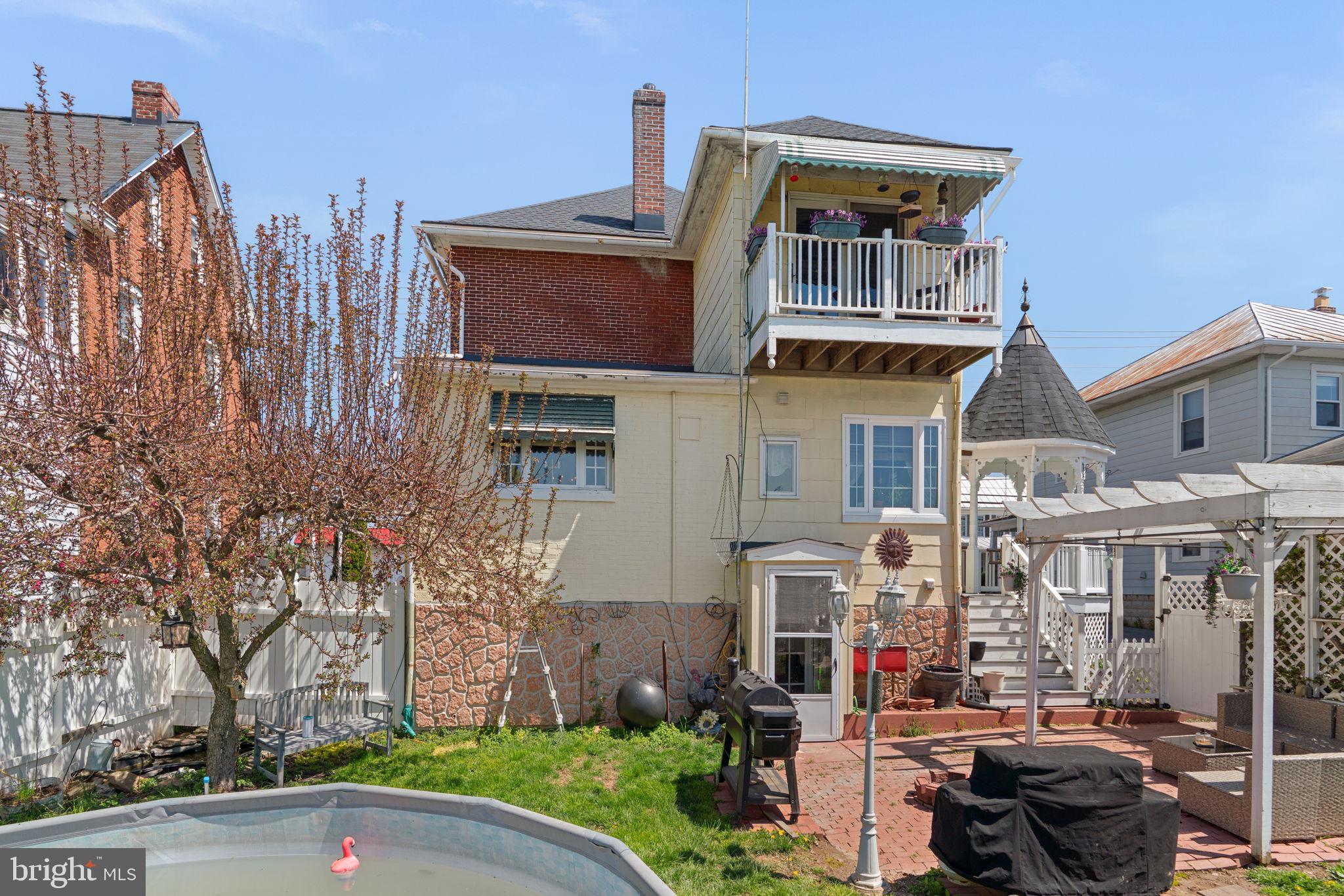 1916 Hanover Pike Hampstead, MD 21074 - Photo 39 of 46 a front view of a residential apartment building with a yard