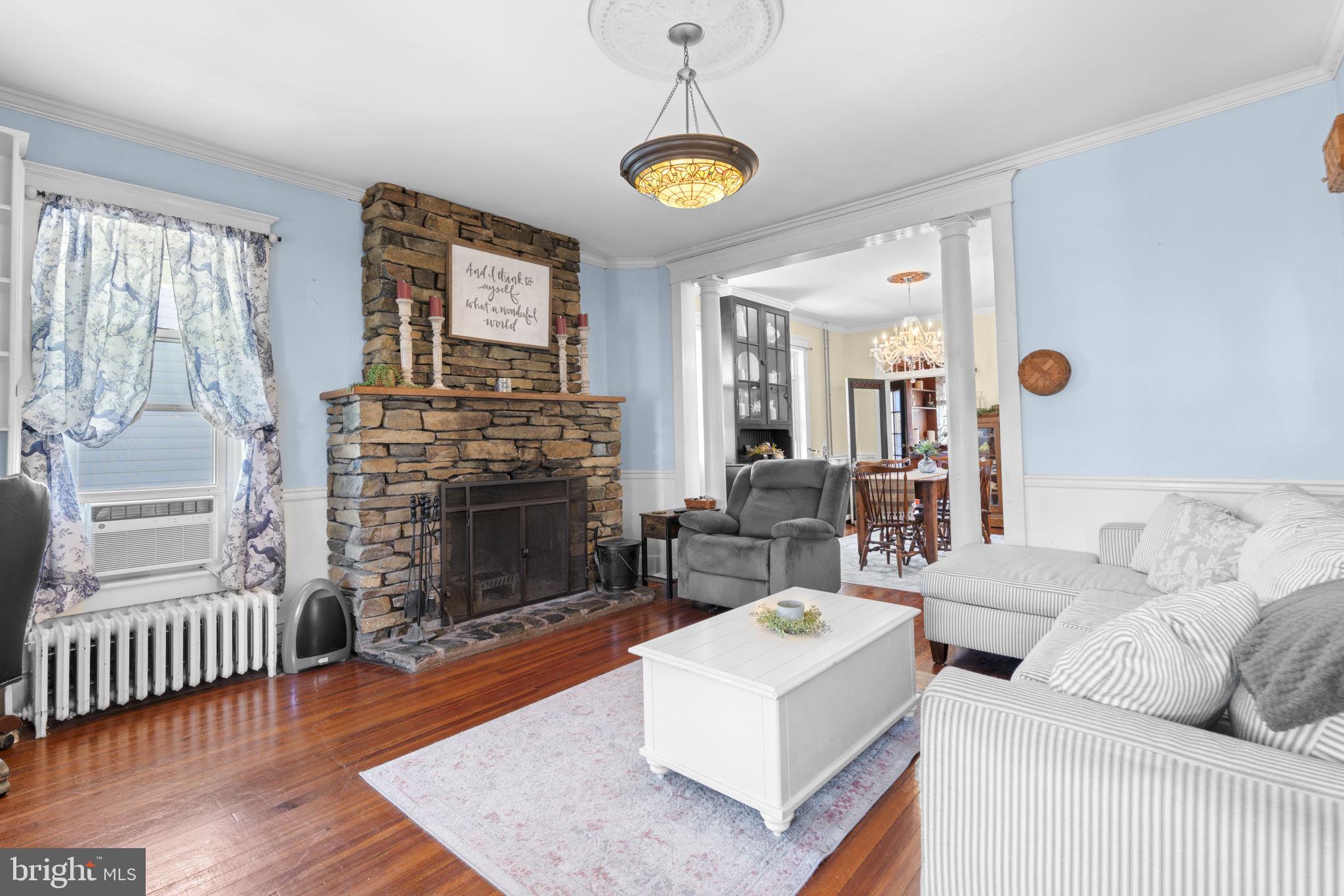 1916 Hanover Pike Hampstead, MD 21074 - Photo 8 of 46 a living room with furniture and a fireplace