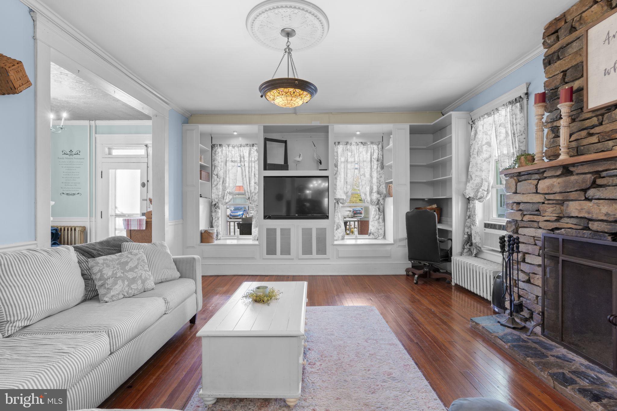 1916 Hanover Pike Hampstead, MD 21074 - Photo 10 of 46 a living room with furniture and a fireplace