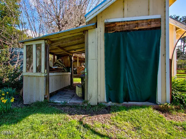 a view of a back yard from a room
