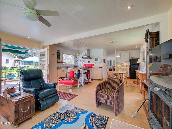 a living room with furniture fireplace and flat screen tv