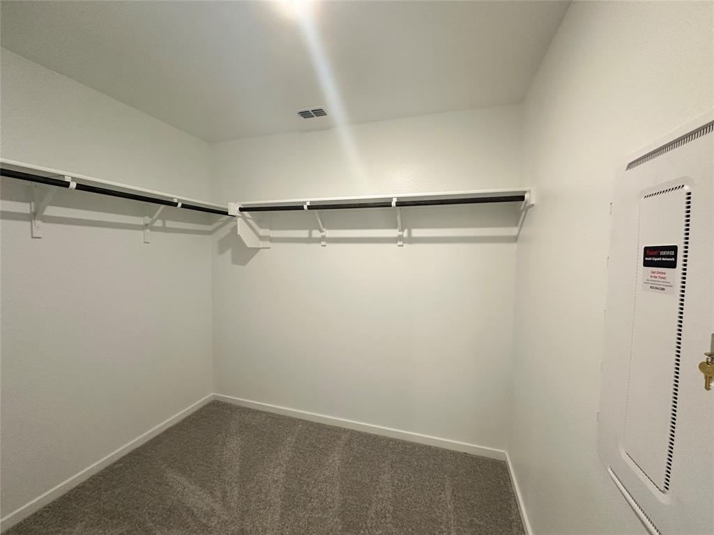 3800 Chambray Drive Sherman, TX 75092 - Photo 14 of 15 Spacious closet with dark colored carpet