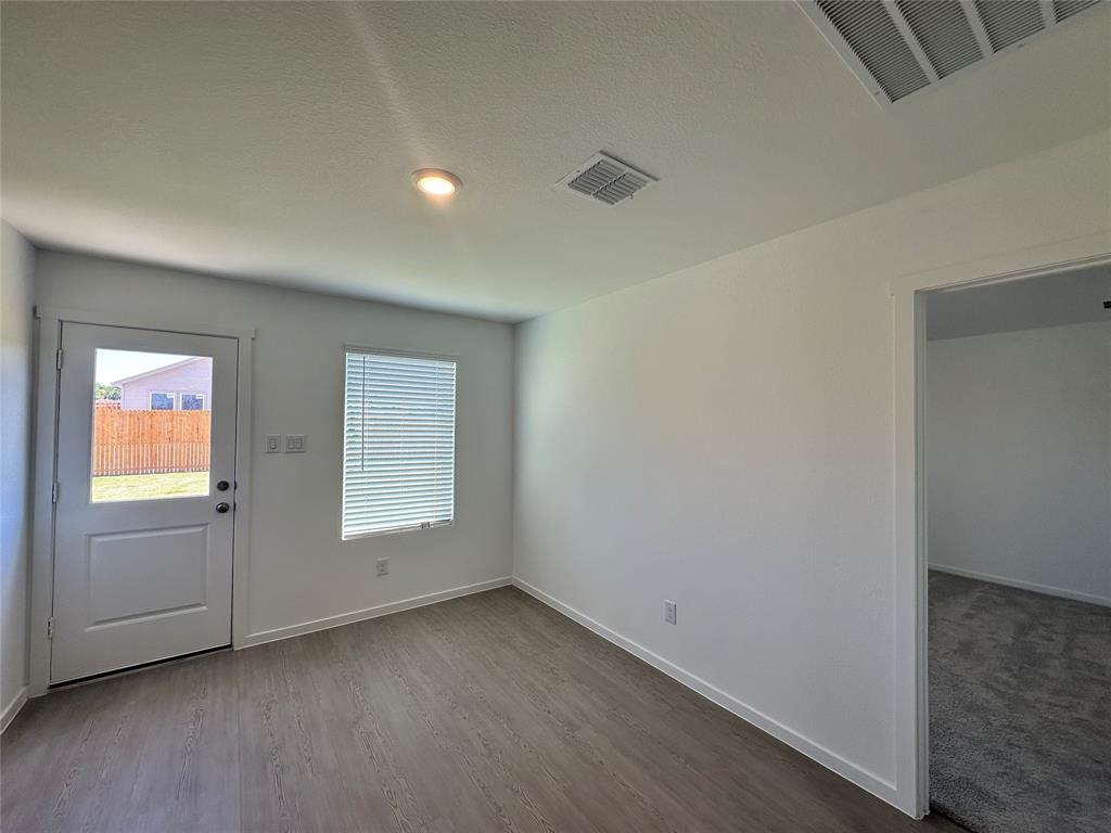 3800 Chambray Drive Sherman, TX 75092 - Photo 2 of 15 Foyer with wood finished floors and a textured ceiling