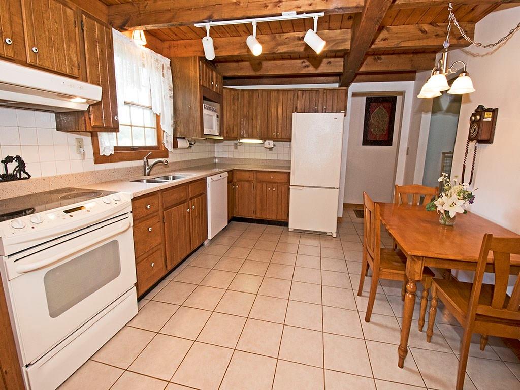 46 Henry Road Tarentum, PA 15084 - Photo 8 of 23 Very Generous Kitchen. Corian Countertops with lots of space. Tons of Storage- And a Window over the kitchen sink for a gorgeous view.