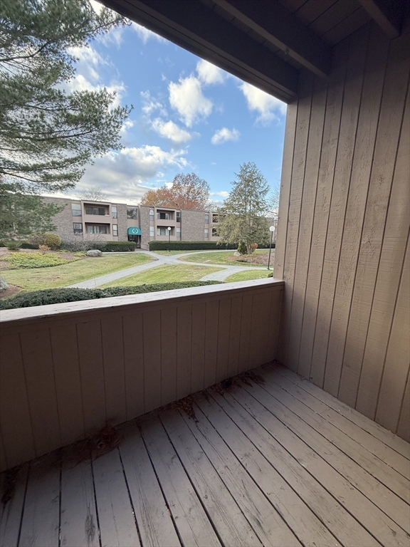 42 Shrewsbury Green Drive, Unit F Shrewsbury, MA 01545 - Photo 13 of 19 a view of balcony with a yard