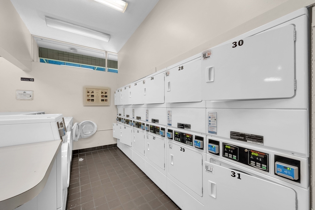 42 Shrewsbury Green Drive, Unit F Shrewsbury, MA 01545 - Photo 17 of 19 a kitchen with stainless steel appliances a sink and cabinets