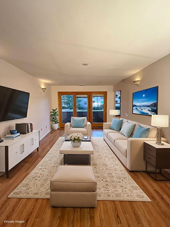 42 Shrewsbury Green Drive, Unit F Shrewsbury, MA 01545 - Photo 2 of 19 a living room with furniture and a flat screen tv