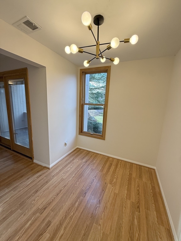 42 Shrewsbury Green Drive, Unit F Shrewsbury, MA 01545 - Photo 9 of 19 a view of room with window and wooden floor