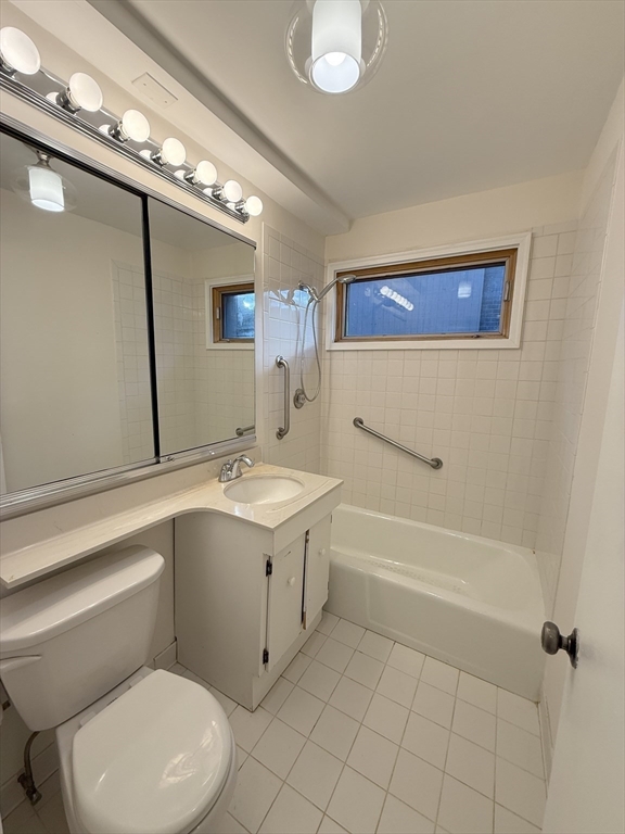 42 Shrewsbury Green Drive, Unit F Shrewsbury, MA 01545 - Photo 10 of 19 a bathroom with a sink a toilet and shower