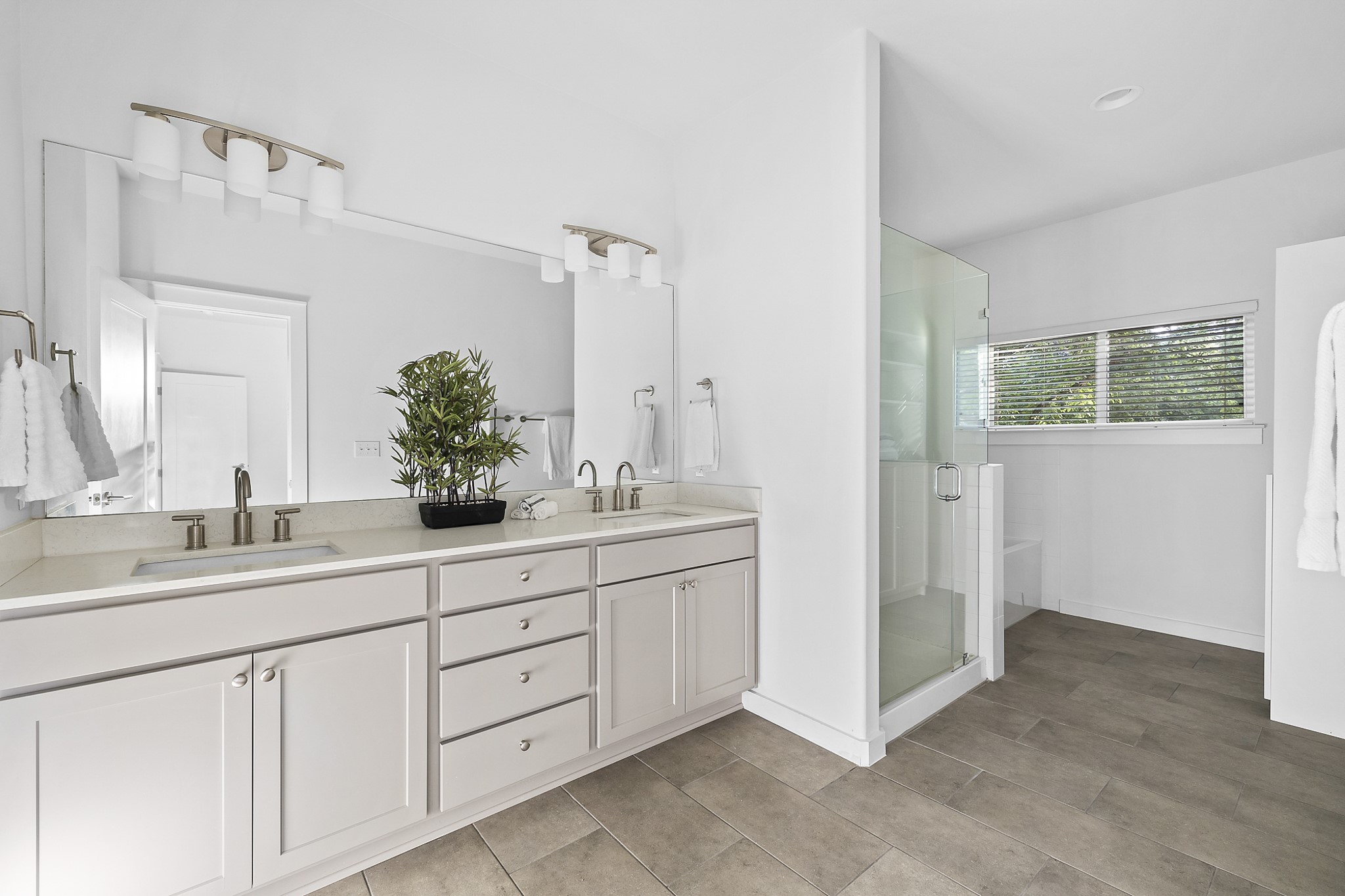 6800 Menchaca Road, Unit 22 Austin, TX 78745 - Photo 12 of 27 a bathroom with a double vanity sink and mirror