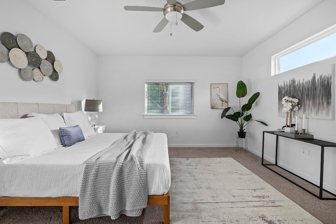 6800 Menchaca Road, Unit 22 Austin, TX 78745 - Photo 12 of 28 Carpeted bedroom featuring a ceiling fan and baseboards