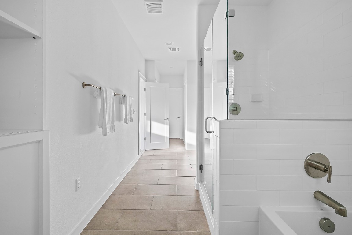 6800 Menchaca Road, Unit 22 Austin, TX 78745 - Photo 15 of 28 Bathroom featuring a stall shower and a bath