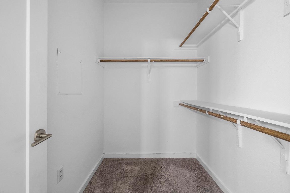 6800 Menchaca Road, Unit 22 Austin, TX 78745 - Photo 17 of 28 Spacious closet featuring dark carpet