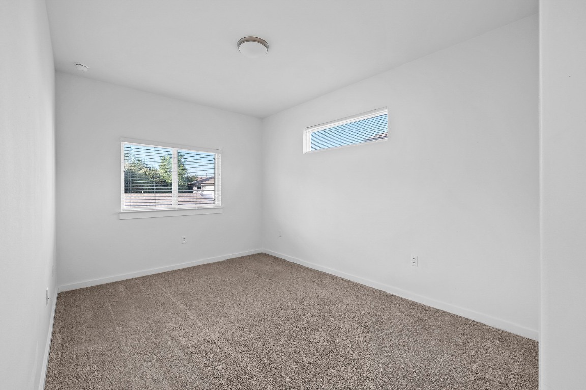 6800 Menchaca Road, Unit 22 Austin, TX 78745 - Photo 18 of 28 Unfurnished room with carpet flooring