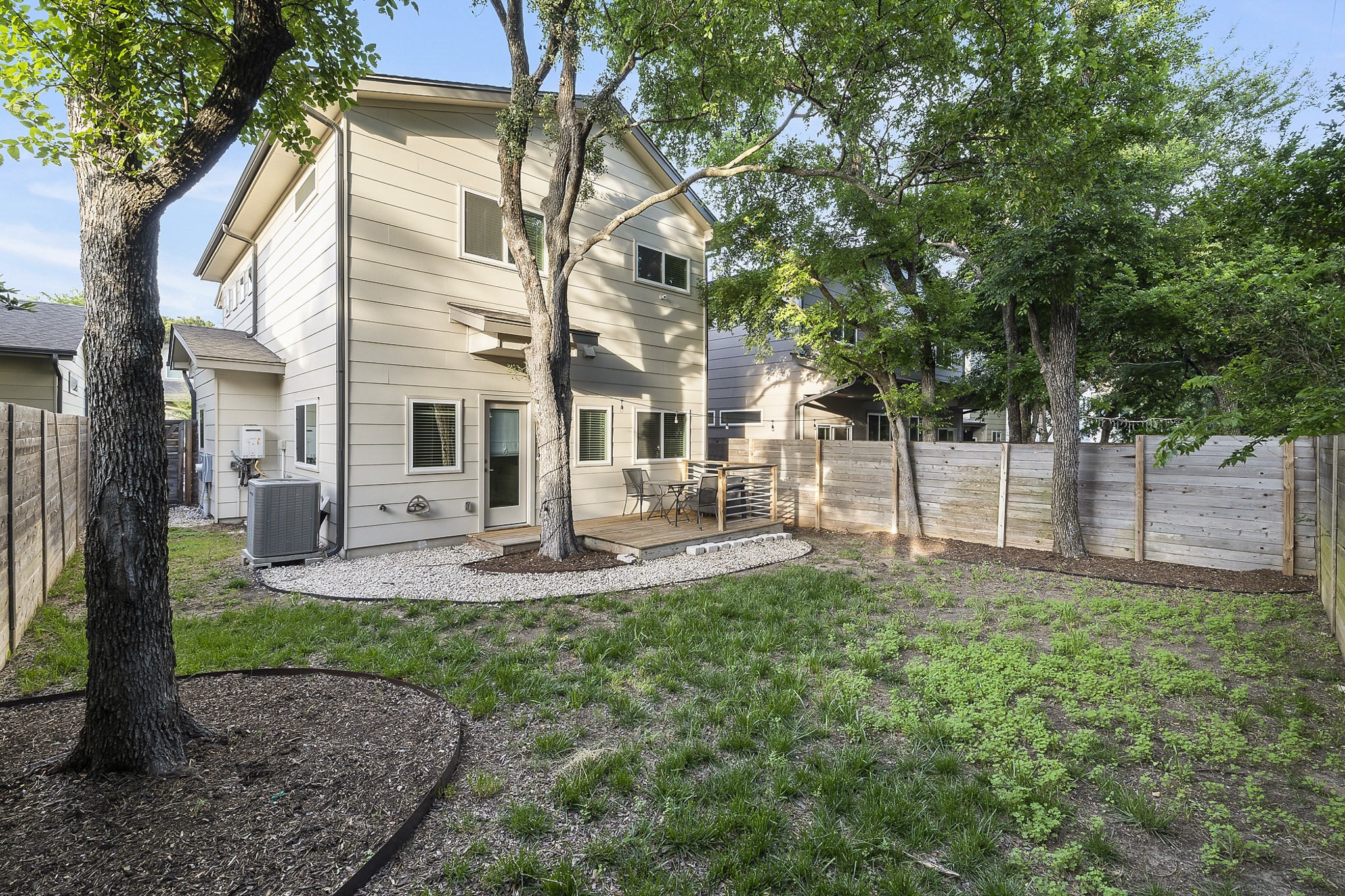 6800 Menchaca Road, Unit 22 Austin, TX 78745 - Photo 21 of 27 a view of a house with backyard and sitting area