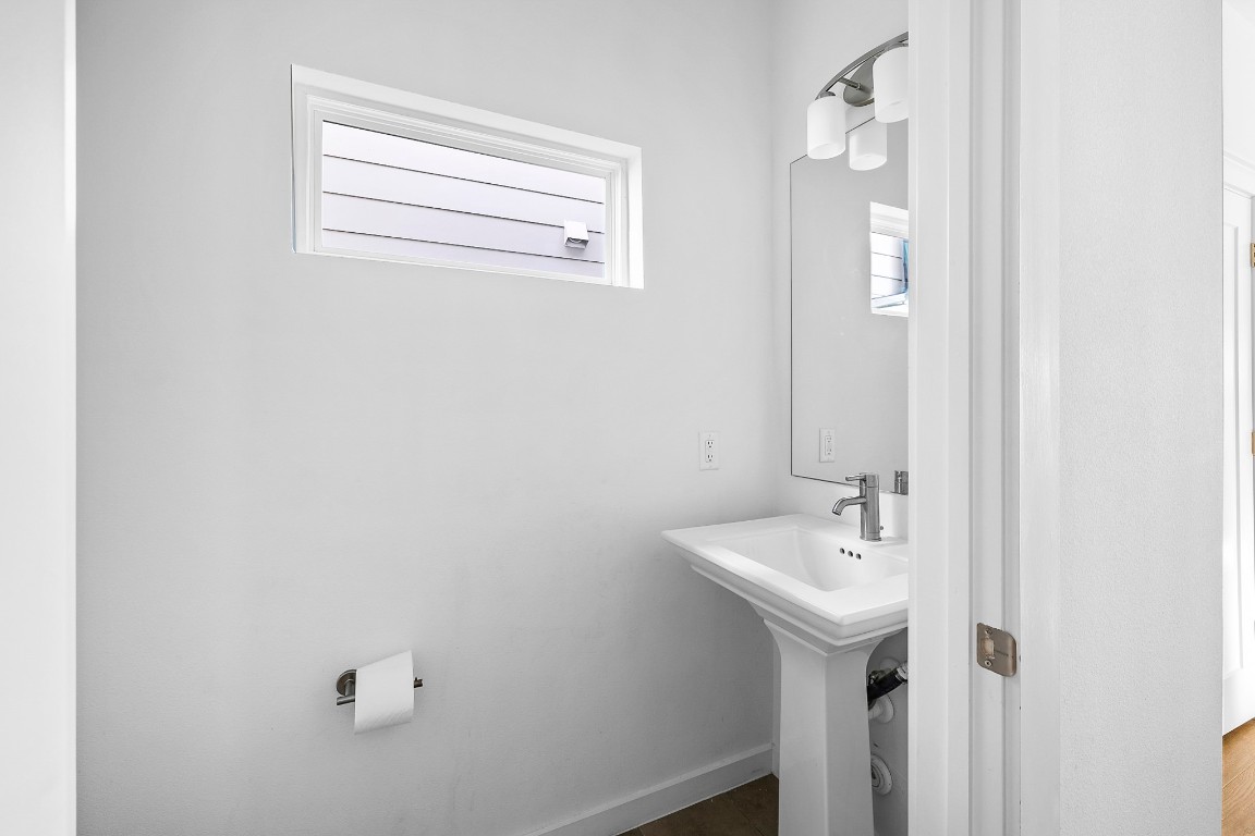 6800 Menchaca Road, Unit 22 Austin, TX 78745 - Photo 7 of 28 Half bathroom featuring plenty of natural light