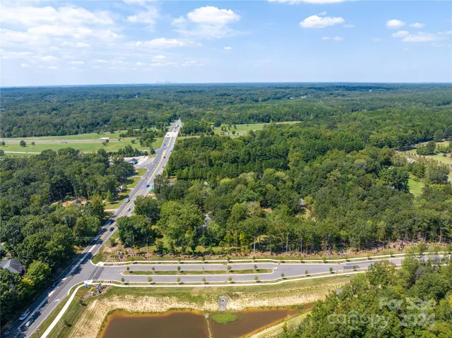a view of a swimming pool with a yard