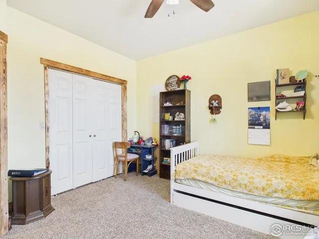 a bedroom with furniture and window