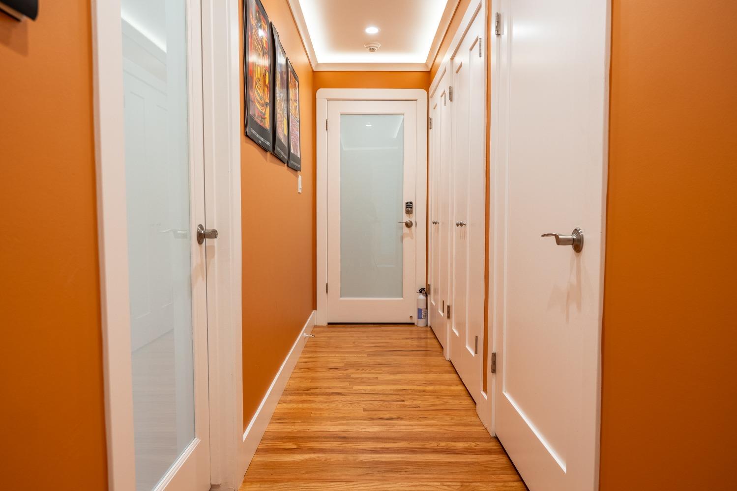 3409 Mansfield Lane Modesto, CA 95350 - Photo 16 of 38 Smoked glass doors and lighting above the molding