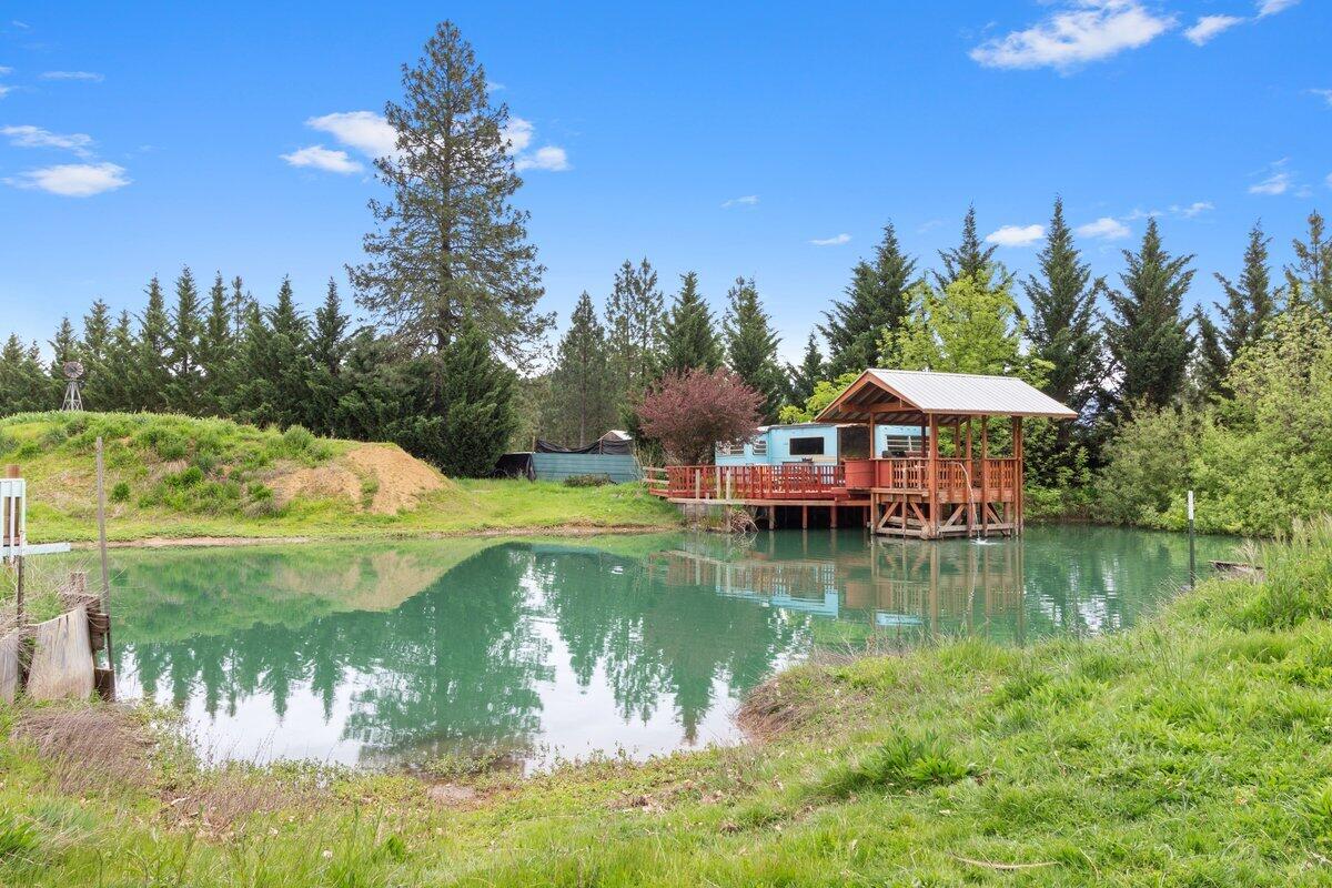 262 Barnes Way Cave Junction, OR 97523 - Photo 2 of 30 Pond and fishing dock