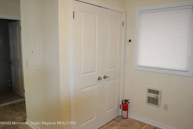 a kitchen with granite countertop a sink stove and cabinets