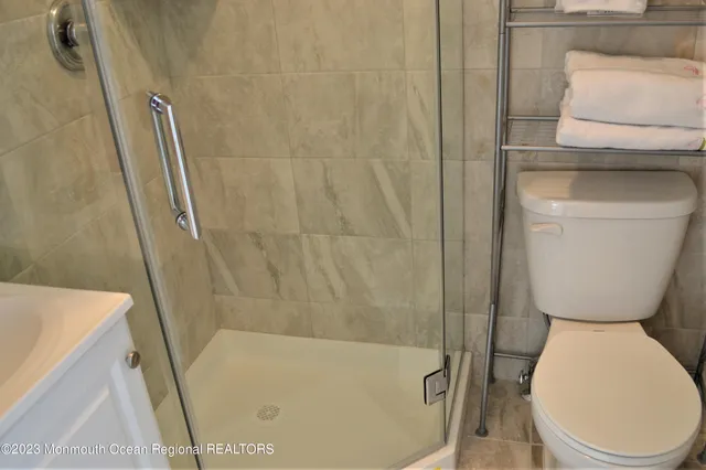 a bedroom with a bed and a mirror