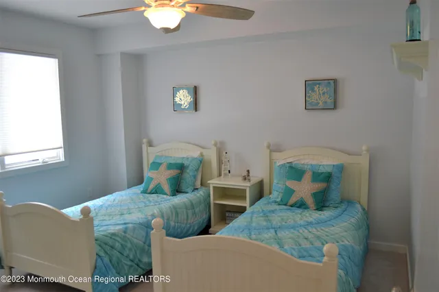 a bathroom with a toilet a sink and shower