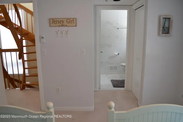 a bedroom with two beds and a window