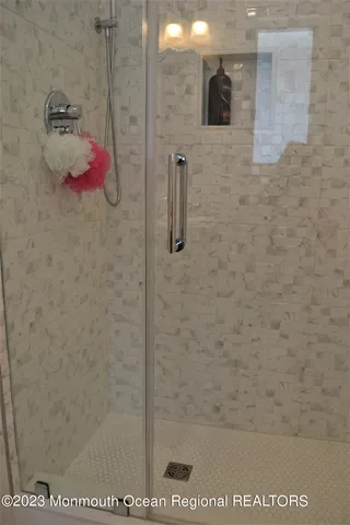 a bathroom with a sink toilet and a mirror