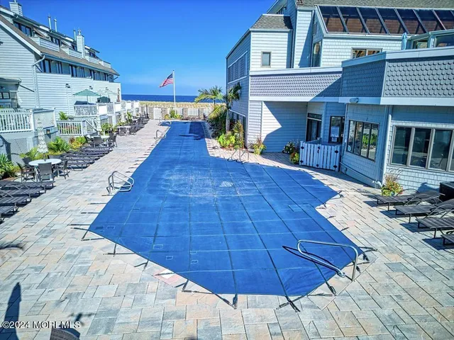 a view of backyard with sitting area