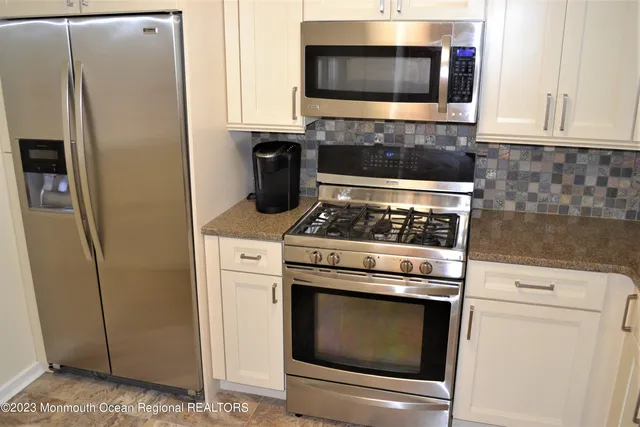 a dining room with furniture and a window