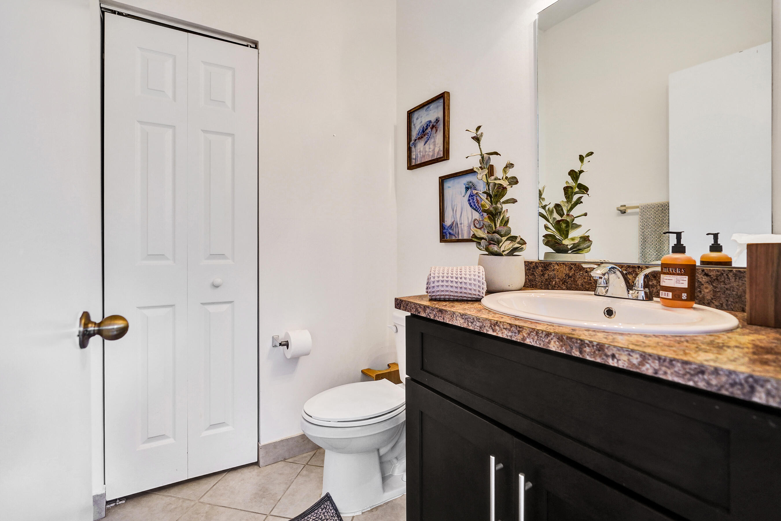 4533 Danson Way Delray Beach, FL 33445 - Photo 13 of 92 a bathroom with a granite countertop sink a toilet and mirror