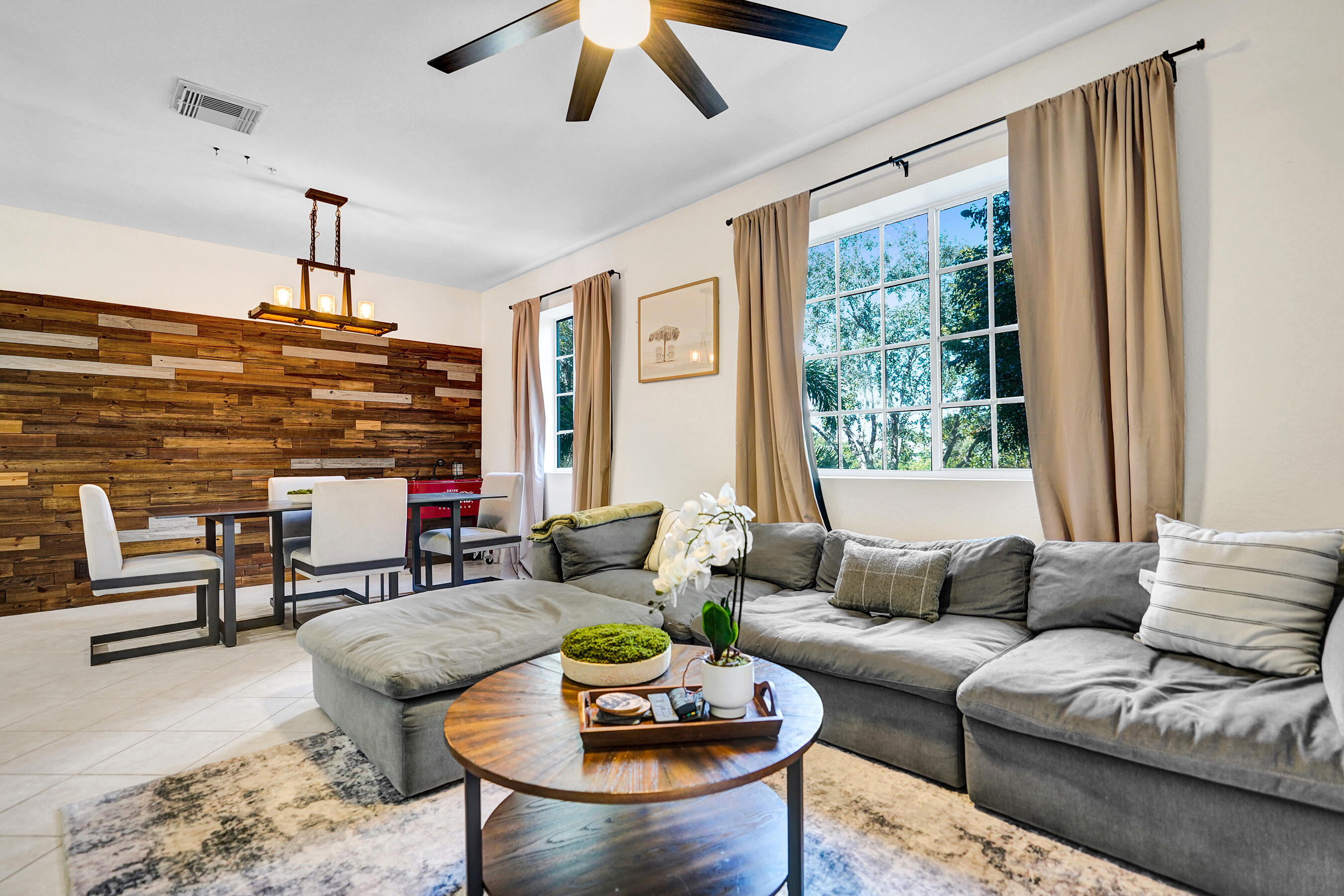 4533 Danson Way Delray Beach, FL 33445 - Photo 19 of 92 a living room with furniture a rug and a large window