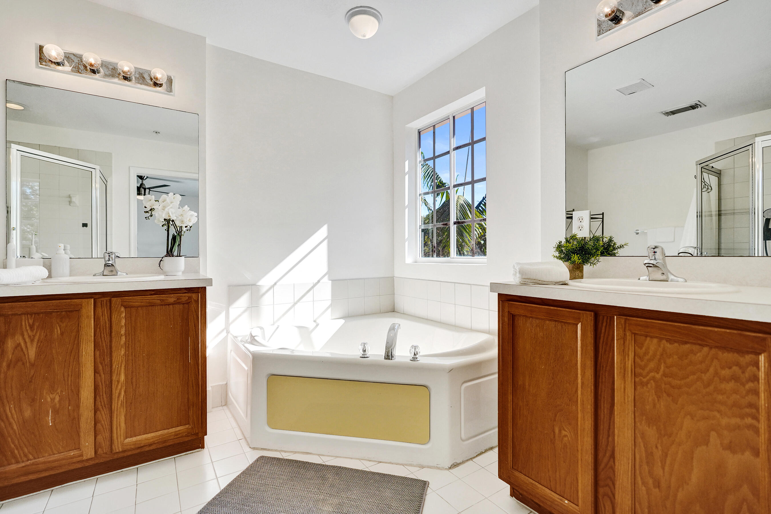 4533 Danson Way Delray Beach, FL 33445 - Photo 43 of 92 a bathroom with a sink and a mirror