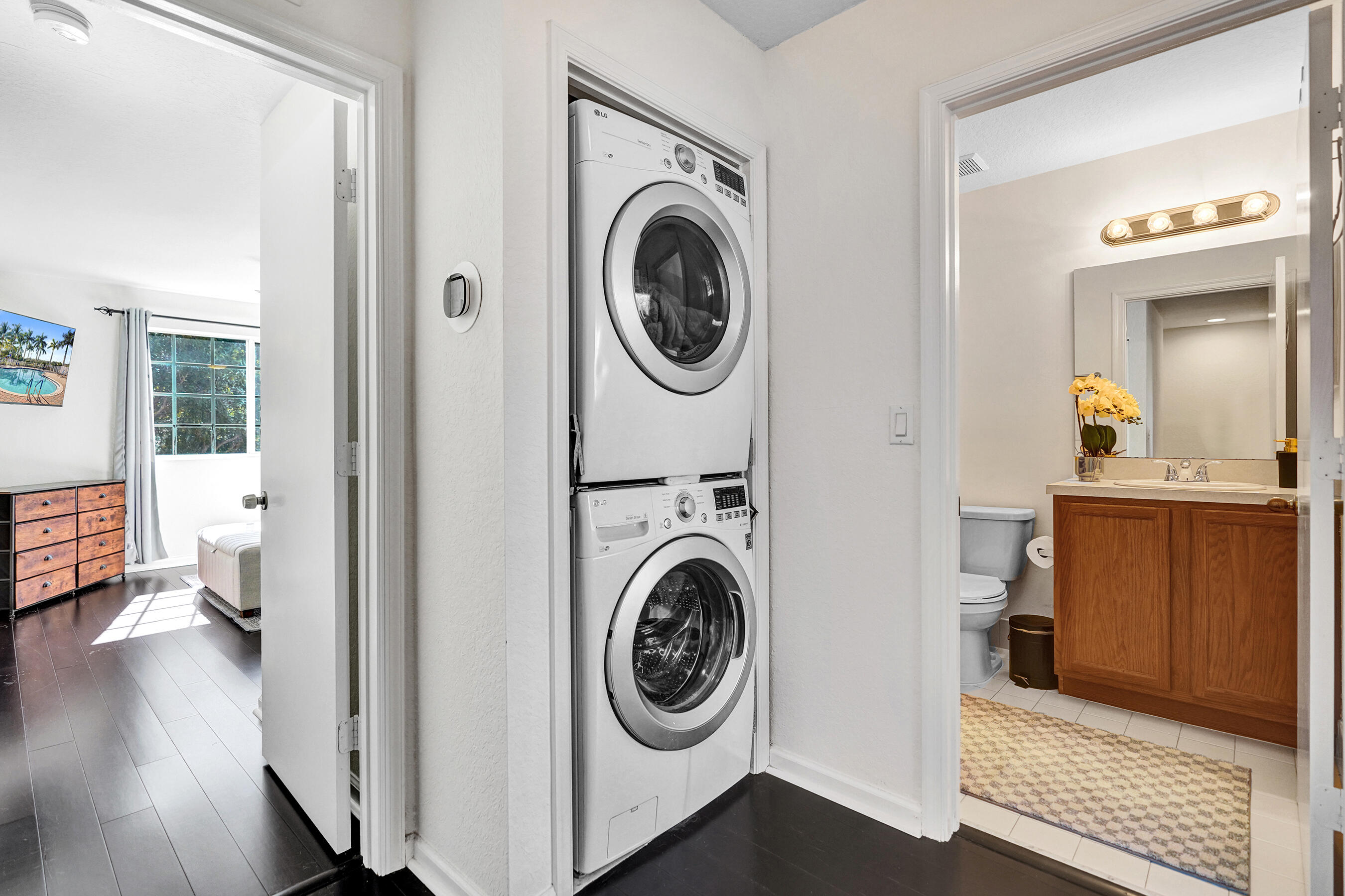 4533 Danson Way Delray Beach, FL 33445 - Photo 51 of 92 a view of a storage and utility room with washer and dryer