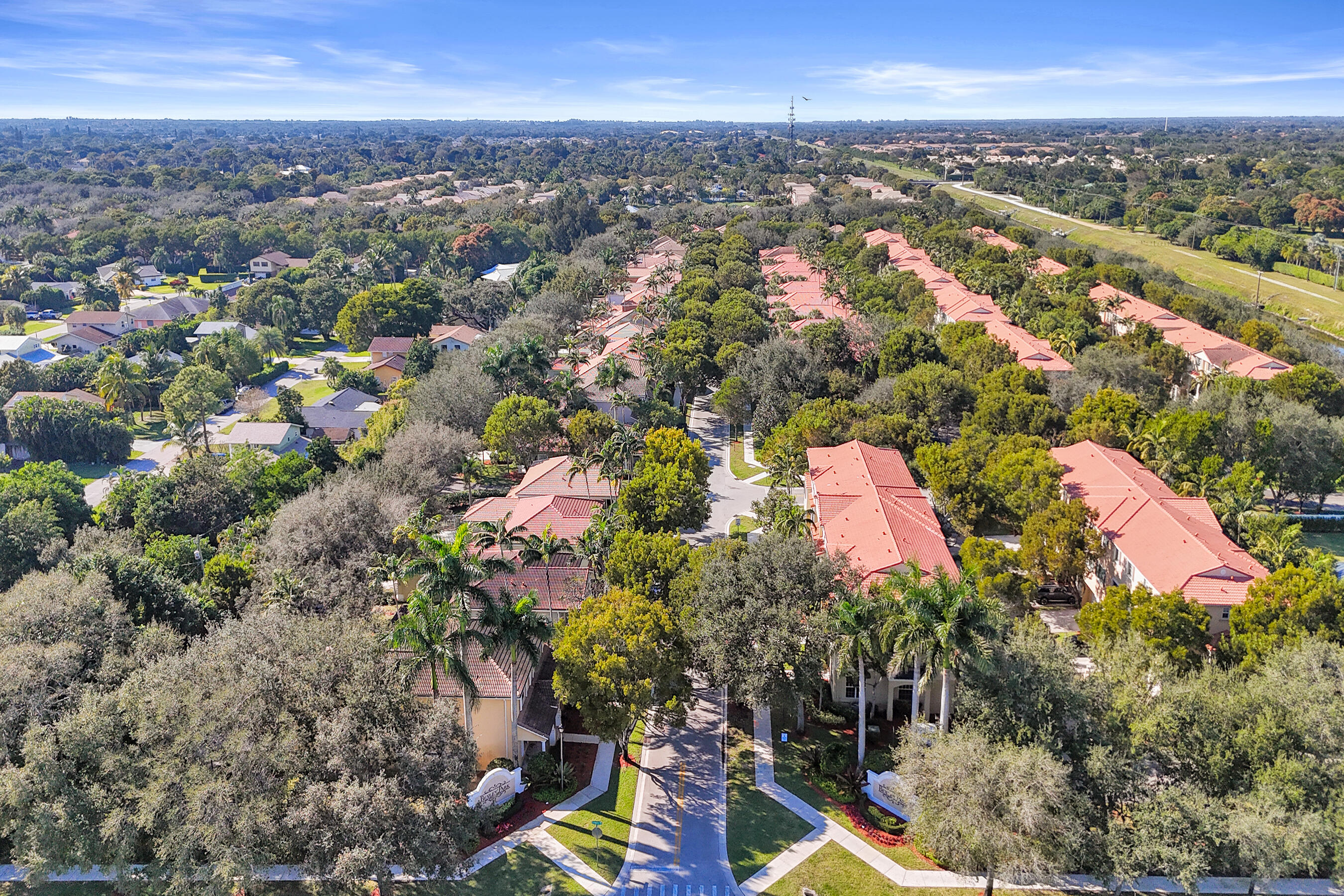 4533 Danson Way Delray Beach, FL 33445 - Photo 84 of 92 an aerial view of residential houses with outdoor space and trees