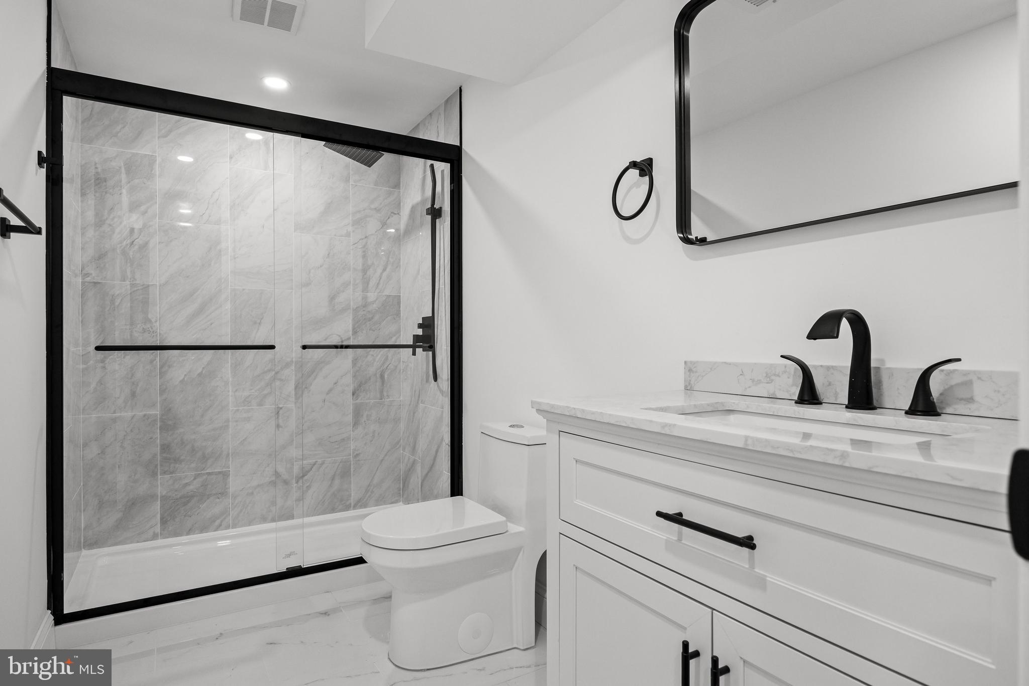 937 Clements Bridge Road Barrington, NJ 08007 - Photo 20 of 34 a bathroom with a shower a toilet and sink