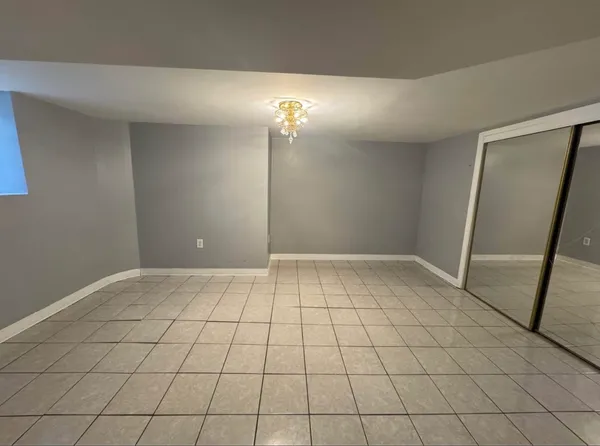 a bathroom with a sink a toilet a mirror and shower
