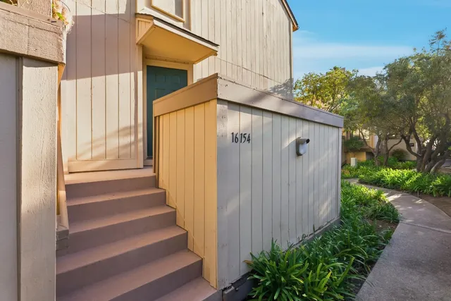 a house with a trees in front of it