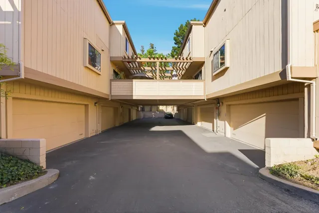 a view of a street with seating area
