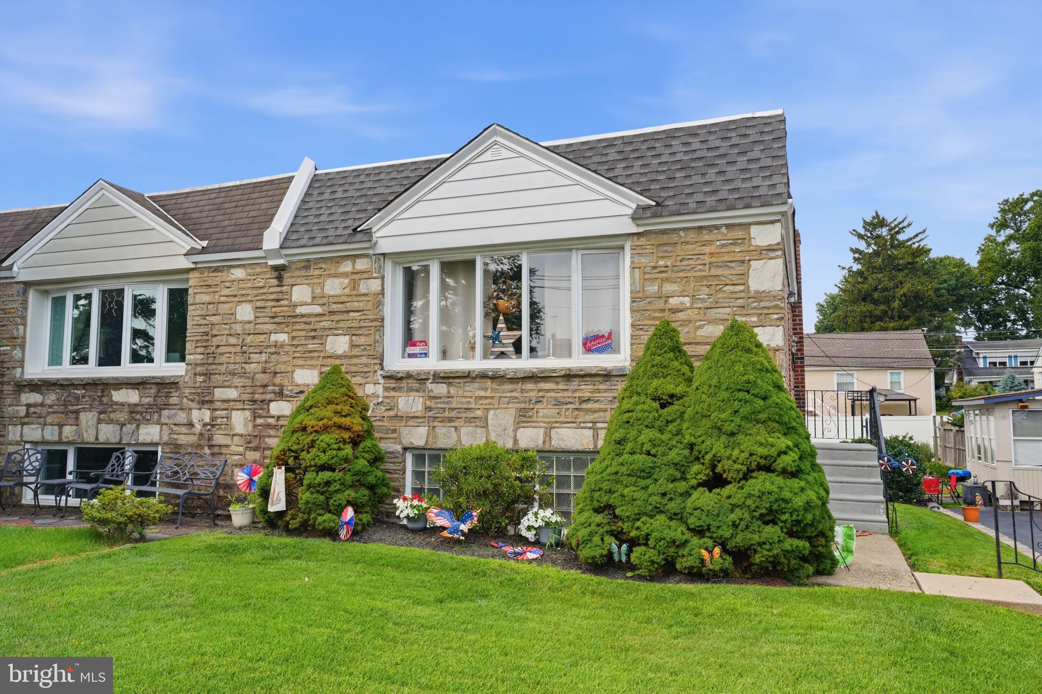 2012 Tomlinson Road Philadelphia, PA 19116 - Photo 2 of 33 Charming stone home with lush greenery.