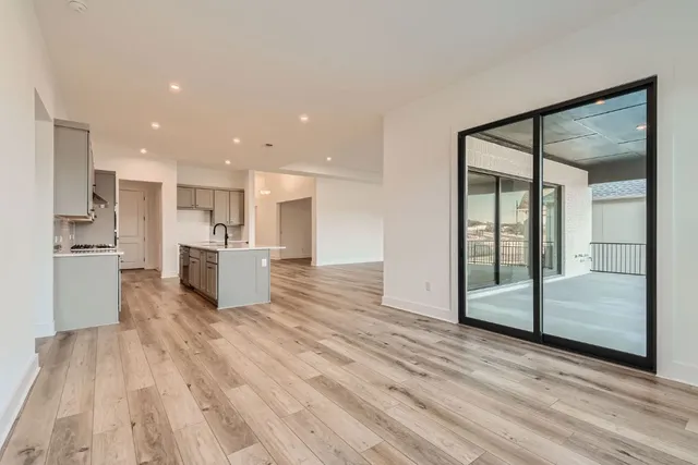 a view of kitchen living space with wooden floor